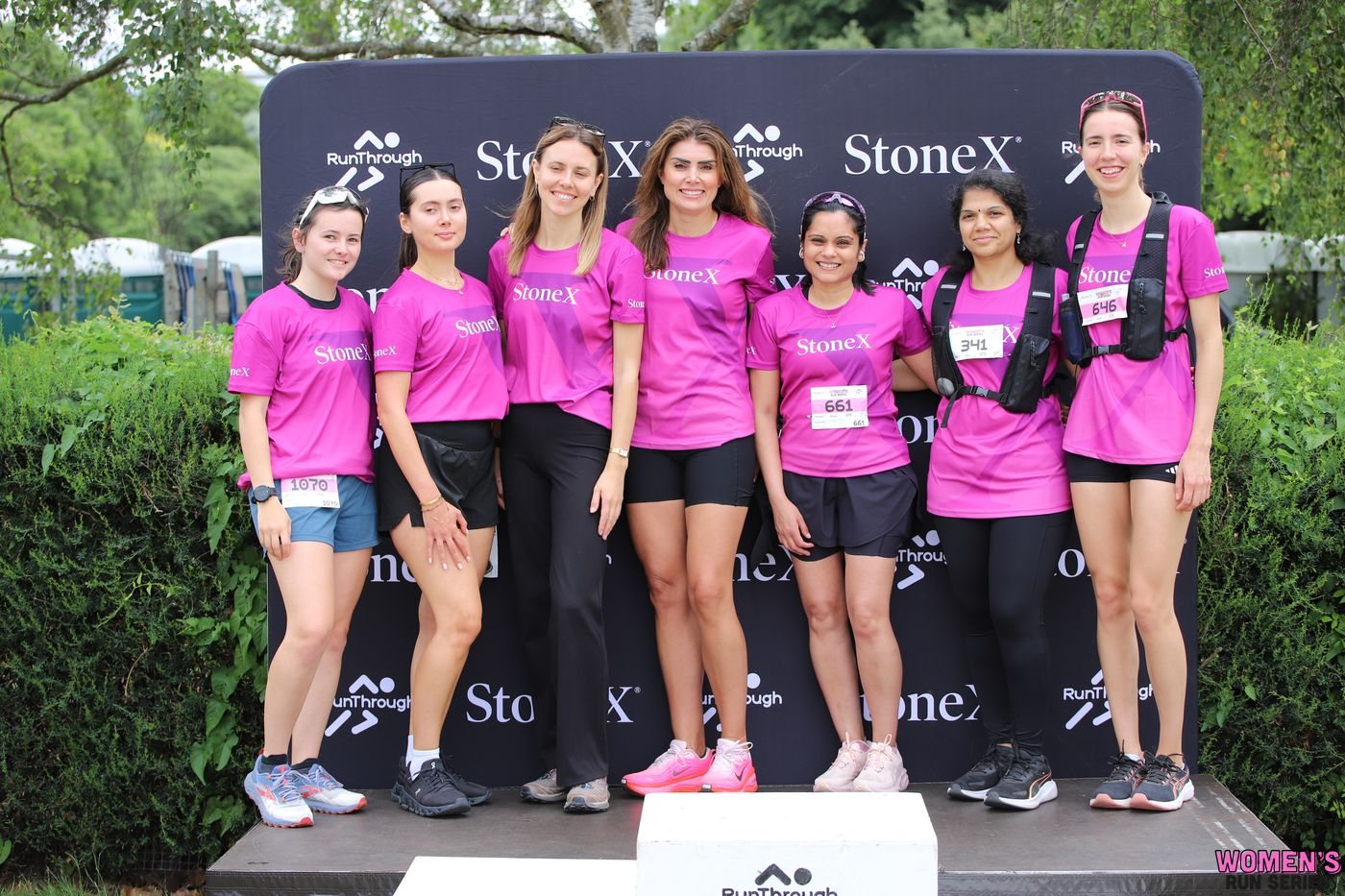 Runners in pink StoneX t-shirts at the Women's Run Series Battersea Park